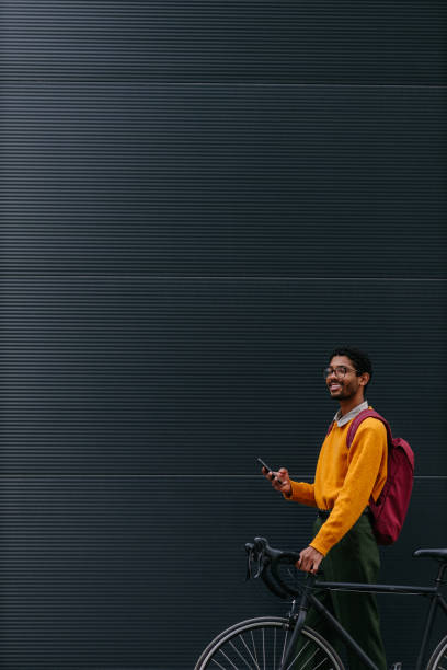 istock Happy hispanic man using mobile smartphone outdoors 1318496683