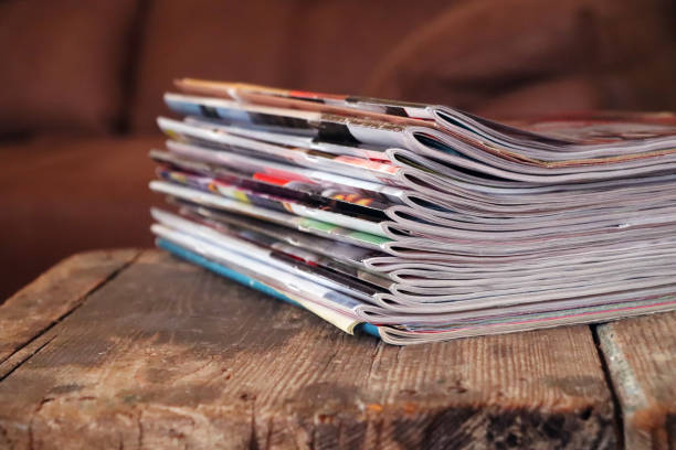 istock Old magazines on wooden table 1318496874