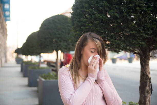 istock Sneezing woman 1318497717