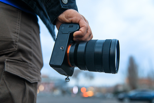 photographer hand camera in street