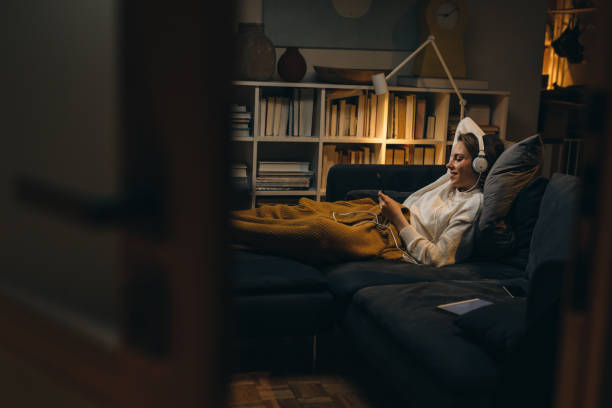 istock woman relaxing at home 1318499509