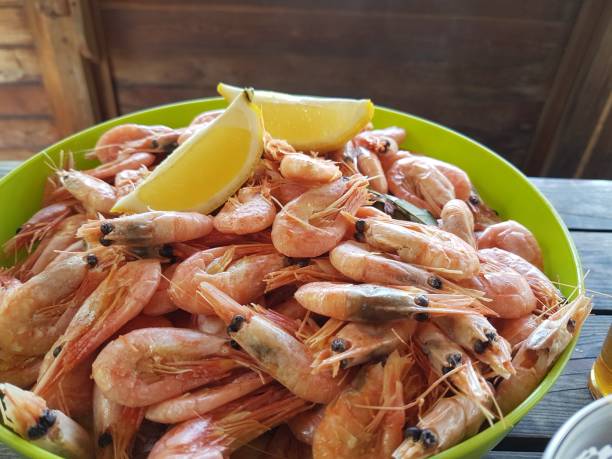 istock Shrimps with beer on a wooden table 1318499619