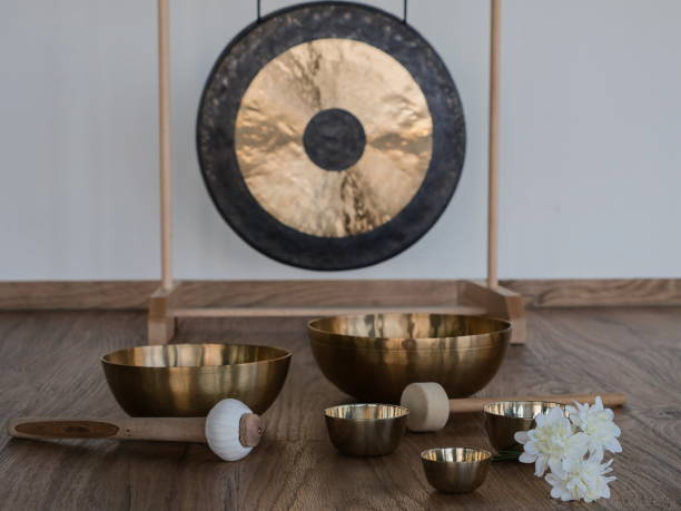 Gong and five singing bowls Gong in background , five singing bowls foreground gong stock pictures, royalty-free photos & images