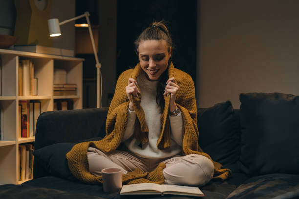 istock woman at home. evening scene 1318504911