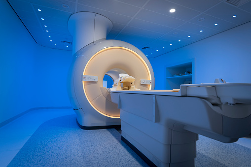 MRI scanner in examination room at the hospital.