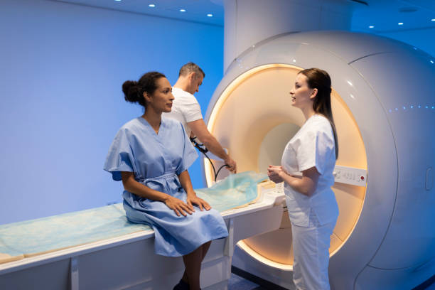istock Mature woman talking with a doctor before MRI scan 1318505434