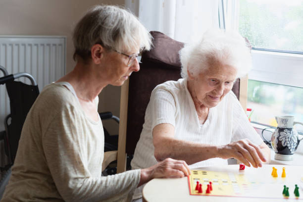 istock Senior woman is playing ludo with her niece 1318507750