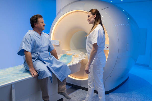 istock Mature man talking with a doctor before MRI scan 1318508320