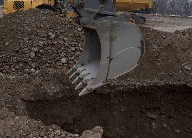 istock earthworks with excavator on construction site 1318512339