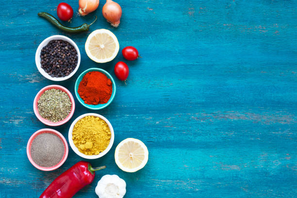 istock Colourful various vegatable and spices for cooking on blue background 1318512818