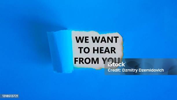 Support Symbol Concept Words We Want To Hear From You Appearing Behind Torn Blue Paper Beautiful Blue Background Business And Support Concept Stock Photo - Download Image Now