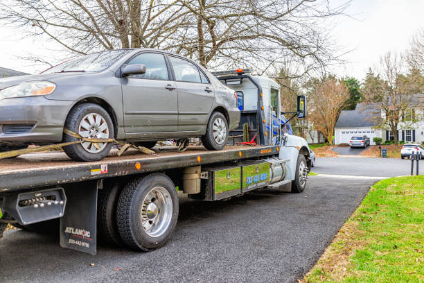 car in driveway with tower tow vehicle truck due to fuel leak trouble damage safety in virginia neighborhood residential - service rig imagens e fotografias de stock