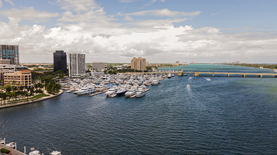 Aerial Footage of Downtown West Palm Beach, Florida Inlet Waterfront & Skyline in May of 2021