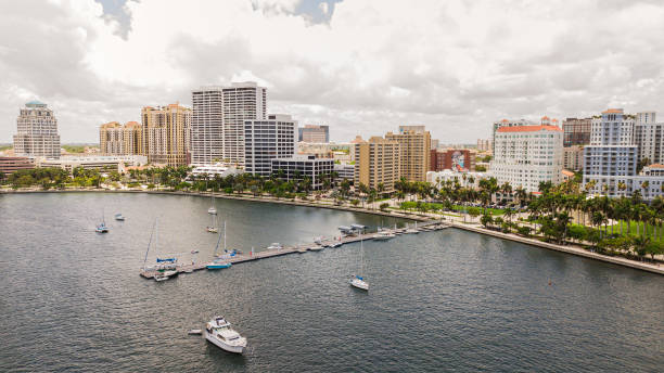 Aerial View of Downtown West Palm Beach, Florida Inlet Waterfront & Skyline in May of 2021 Aerial Footage of Downtown West Palm Beach, Florida Inlet Waterfront & Skyline in May of 2021 west palm beach stock pictures, royalty-free photos & images