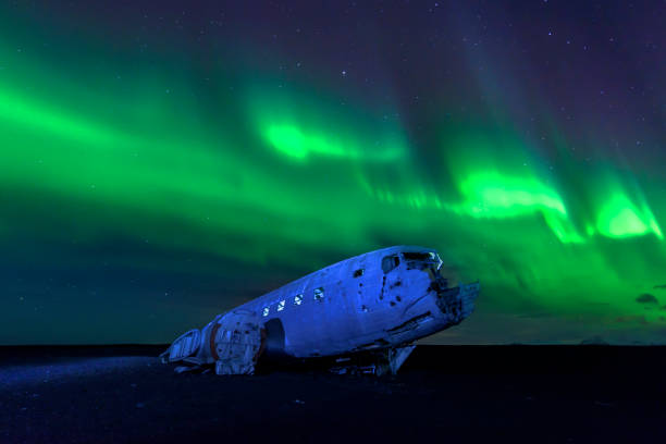 istock Northern lights over plane wreckage in Iceland 1318518220