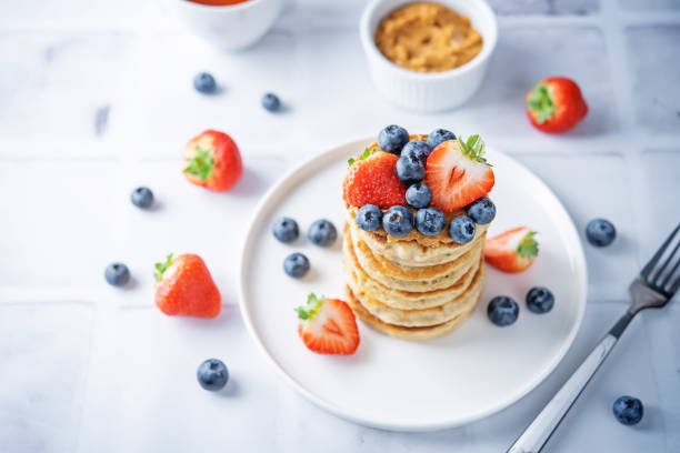 istock Banana pancakes with strawberries and blueberries 1318519061