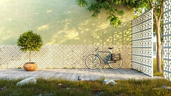 A bicycle by an old building wall