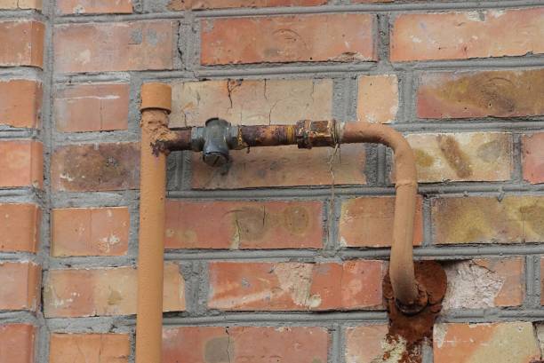 istock gas pipe on brown brick wall outside 1318519372