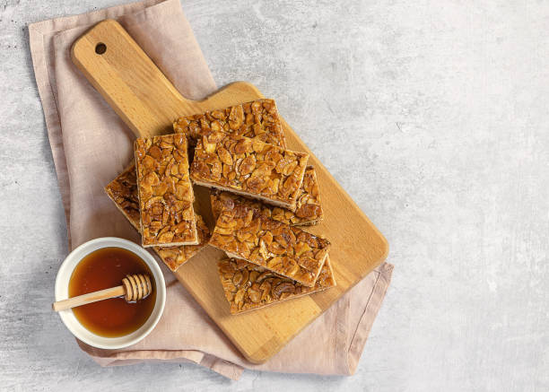 istock Almond florentines or Bee sting, thin shortbread covered cookies with honey 1318522509