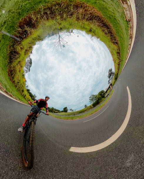 part of cyclist in motion on city background. focus on foreground of paving slabs. Moskow Russia, Crimean embankment