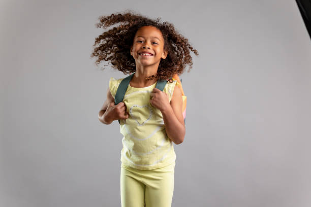 istock Young Student With School Bag Jumping Around 1318524022