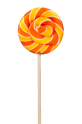 Twisted sweet yellow lollipop isolated on white background