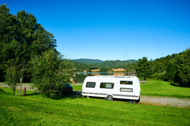 beautiful campsite with blue sky in nature by the lake - germany reservoir water tree imagens e fotografias de stock