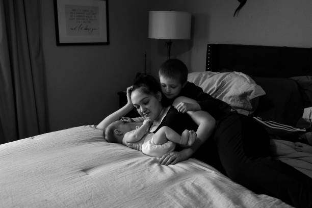 istock A mother and her two sons play on a bed 1318528922