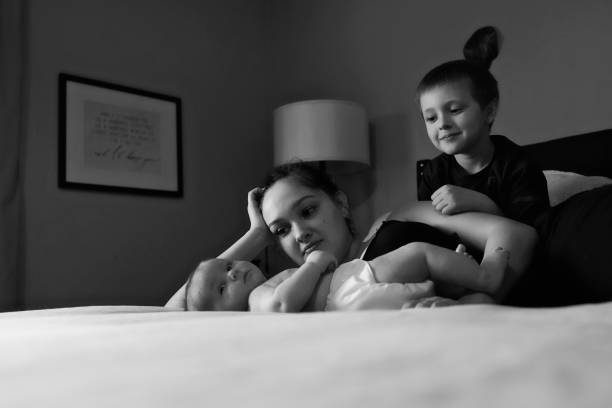 istock A mother and her two sons play on a bed 1318528959