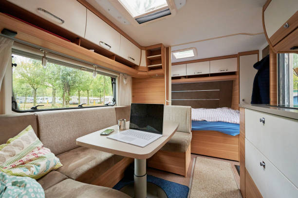 istock Working in a caravan with a laptop on holiday travel 1318529173