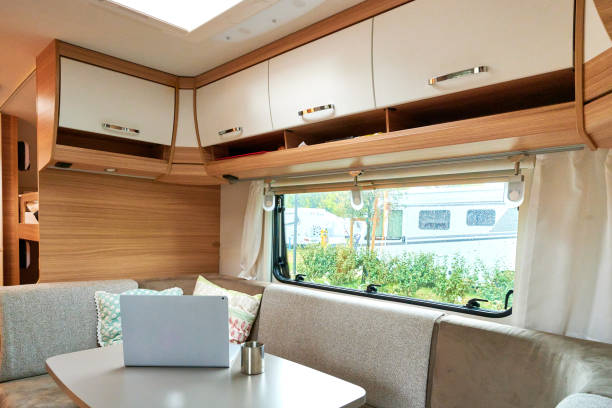 istock Working in a caravan with a laptop on holiday travel 1318529186