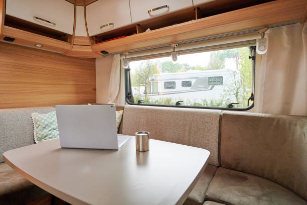 istock Working in a caravan with a laptop on holiday travel 1318529192