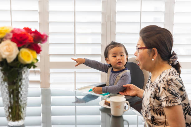 istock Grandmother and Grandson Eating Breakfast 1318530277