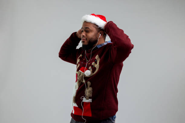 Free Stock Photo of Young guy in a sweater and a Santa hat | Download ...