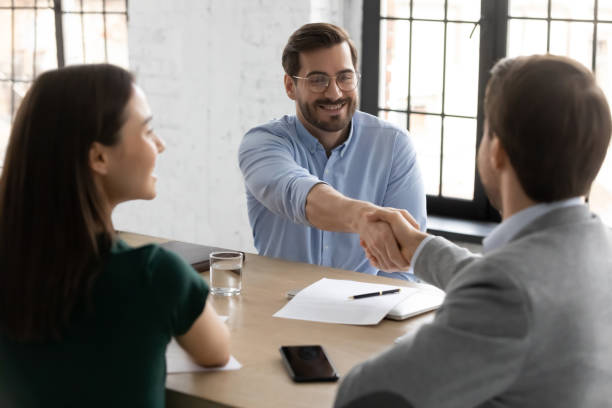 istock Happy employee candidate shaking hands with employer or recruiter 1318531384