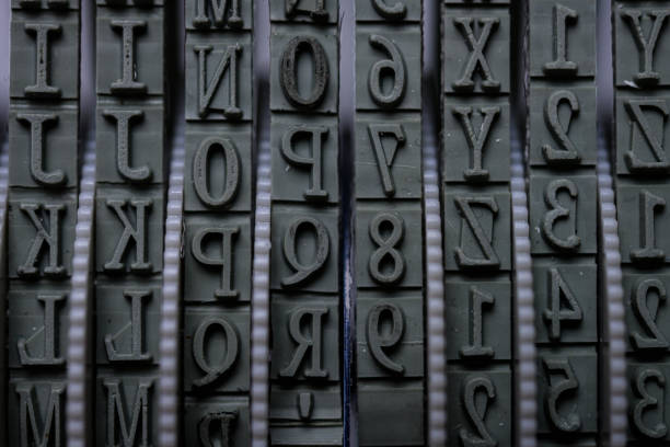 istock Rolling rubber stamp letters and numbers macro shot. 1318532035