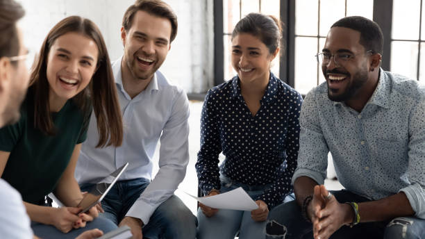 istock Coach or group leader telling funny story or joke 1318533337