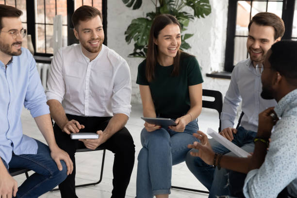 istock Excited diverse team of trainees or interns brainstorming on training 1318533339