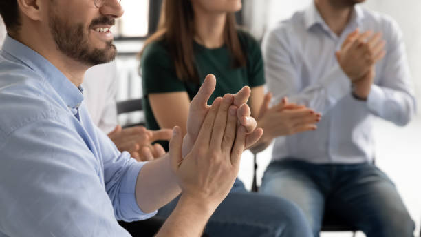 istock Arms of audience applauding presenter, thanking for good 1318533341