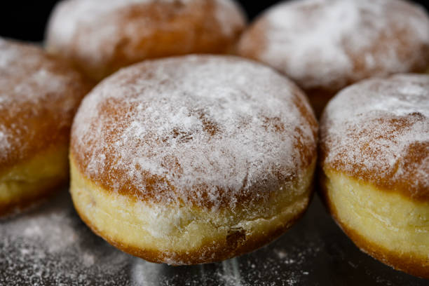 istock Chocolate or jelly filled donuts sprinkled with powder sugar 1318533440
