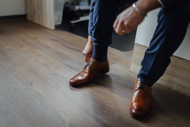 istock Groom's shoes at his wedding 1318536784