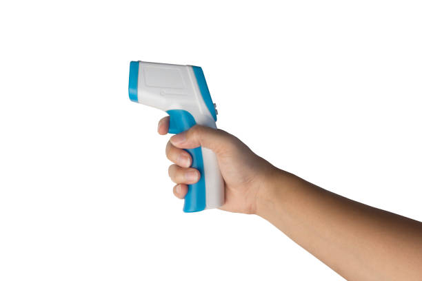 istock Hand holding a Thermometer gun for measuring temperature isolated on white background with clipping path. 1318547496