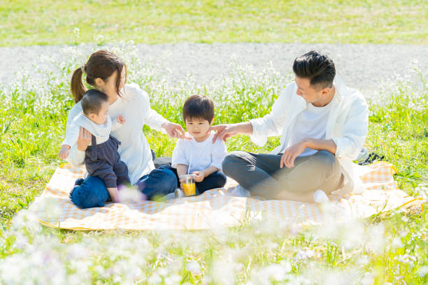 istock Parents and children enjoying a picnic 1318549826