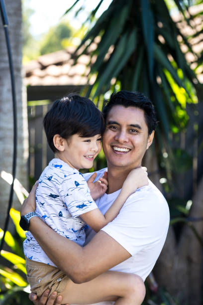 istock Father And Young Son Embracing 1318552841