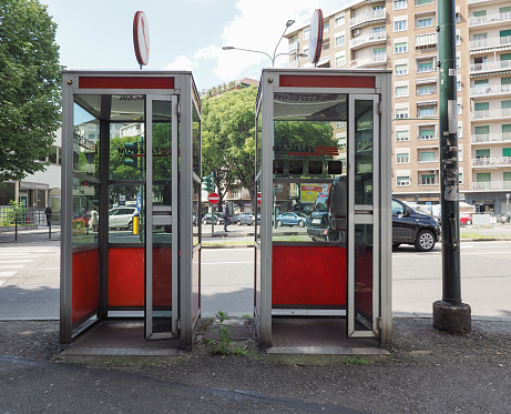 Turin, Italy - Circa May 2019: Vintage Telecom red phone boxes