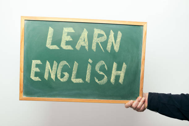 istock chalkboard with LEARN ENGLISH handwritten in chalk 1318555745