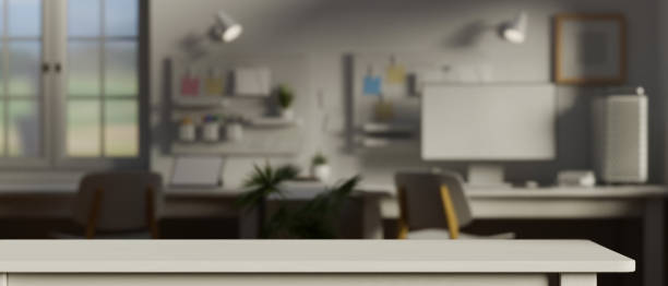 istock Empty white table in the office room with supplies and computer device in the background, 3D rendering 1318557113