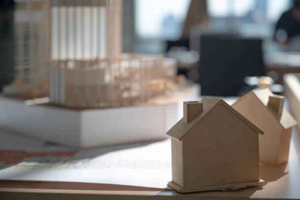 istock Close up Building model project on the table at the property office. 1318557847