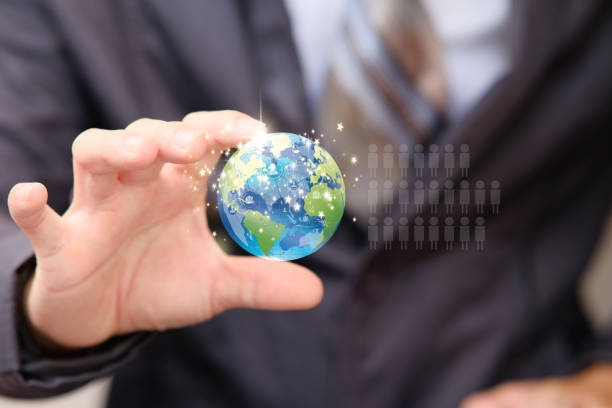 istock Businessman hand holding earth 1318561386