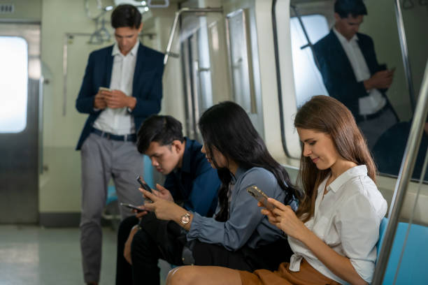 istock Business People passenger using smartphone in the subway while traveling to work. 1318562286